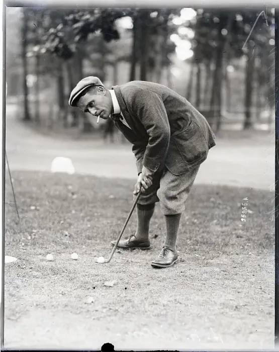 Framed Print : Golfer H. H. Hilton Smokes While Putting