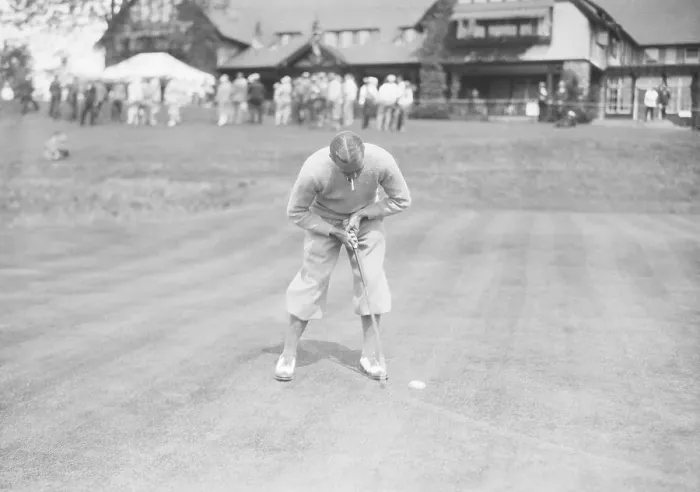 Framed Print : Golfer Putting in Awkward Stance Framed Print : Golfer Putting in Awkward Stance