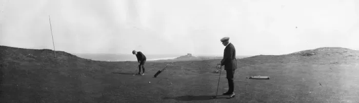 Framed Print : Golfers. April 1901: Two men play golf at Bamburgh Castle, Northumberland Framed Print : Golfers. April 1901: Two men play golf at Bamburgh Castle, Northumberland