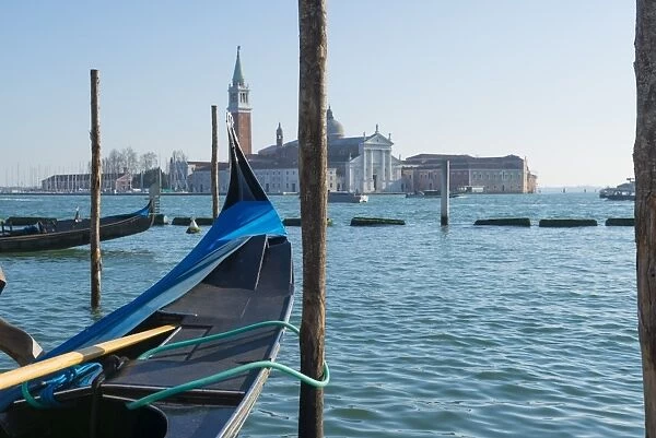Gondola and island San Giorgio Maggiore in a sunny day in Venice, Italy
