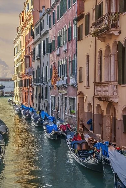 Gondolas in a small channel of Venice