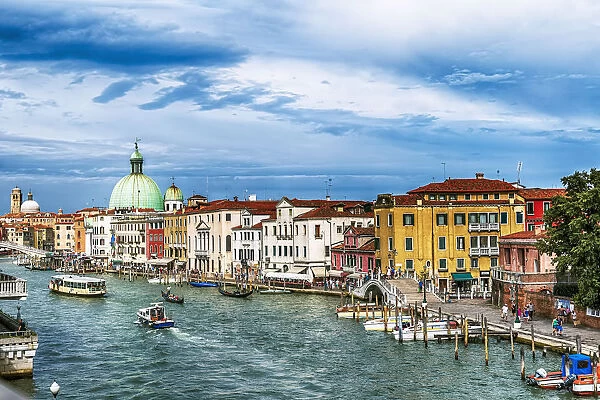 Gondolas, Vaporetto And San Simone Piccolo Church Dome Along The Grand Canal. Its Venice, Italy