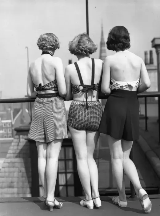 Framed Print : Good View. 1st April 1935: Three models wearing two-piece swimsuits with tailored shorts
