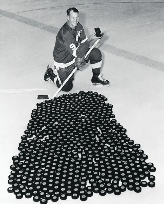Framed Print : Gordon Howe on Ice With Hundreds of Pucks