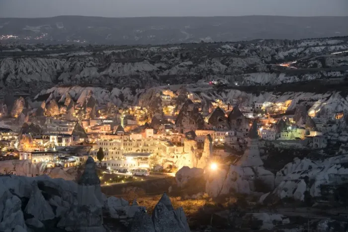 Framed Print : Goreme, View of cliff dwelling and village at nigh Framed Print : Goreme, View of cliff dwelling and village at nigh