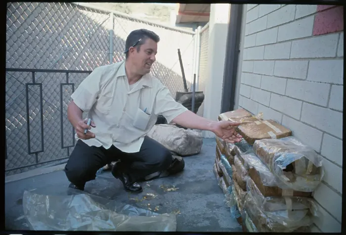 Framed Print : Government Agent Examining Drug Find Framed Print : Government Agent Examining Drug Find