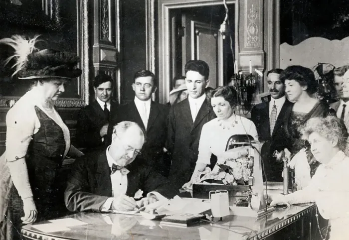 Framed Print : Governor Dunne and Wife as He Signs Voting Bill for Women Framed Print : Governor Dunne and Wife as He Signs Voting Bill for Women