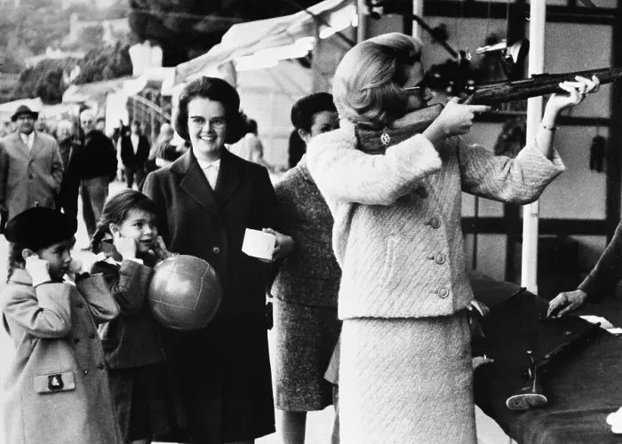 Framed Print : Grace Kelly Aiming Rifle with Princess Caroline Framed Print : Grace Kelly Aiming Rifle with Princess Caroline