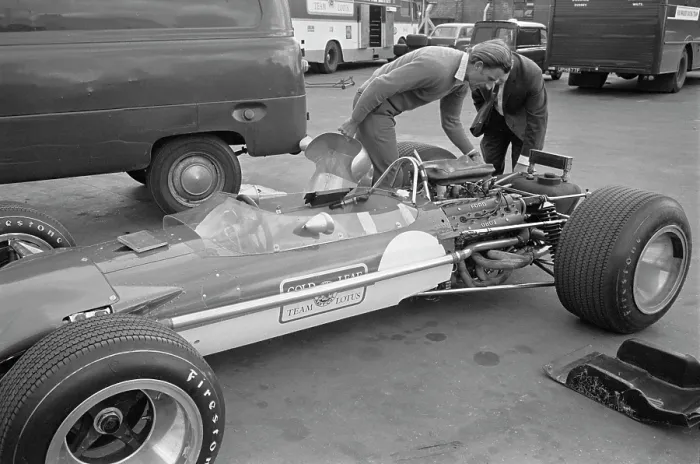 Framed Print : Graham Hill Inspects Car
