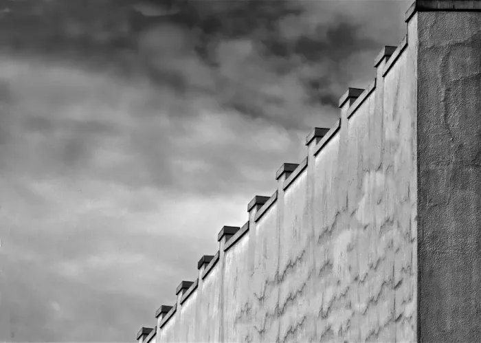 Framed Print : Gray Wall. A black and white photograph of the surrounding wall to a commercial