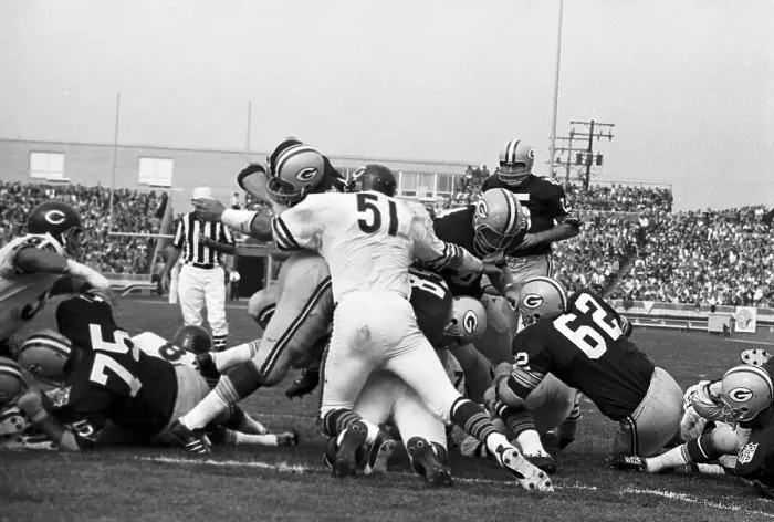 Framed Print : Green Bay Packer Player Being Stopped by Opponents Framed Print : Green Bay Packer Player Being Stopped by Opponents