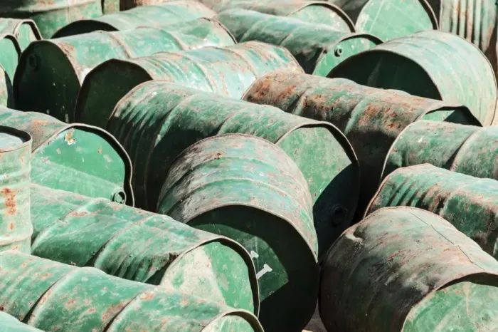 Framed Print : Green metal barrels