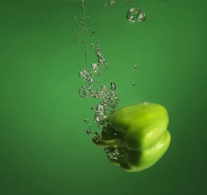 Framed Print : green pebber fruit splashed into water Framed Print : green pebber fruit splashed into water