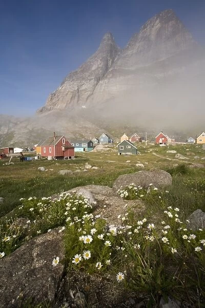 Greenland, Aappilattoq, morning fog covering small cottages in native fishing and hunting village