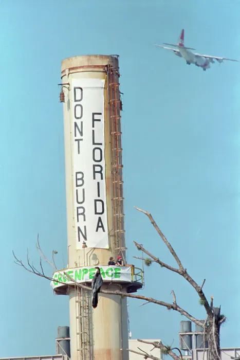 Framed Print : Greenpeace Banner On Smokestack Framed Print : Greenpeace Banner On Smokestack