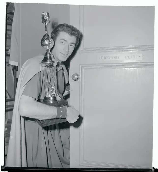 Framed Print : Gregory Peck Holding a Trophy Framed Print : Gregory Peck Holding a Trophy