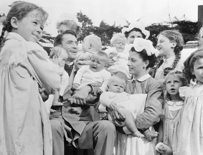Framed Print : Gregory Peck Kissing Babies Framed Print : Gregory Peck Kissing Babies