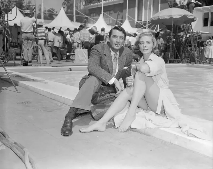 Framed Print : Gregory Peck and Lauren Bacall Sitting by Pool Framed Print : Gregory Peck and Lauren Bacall Sitting by Pool