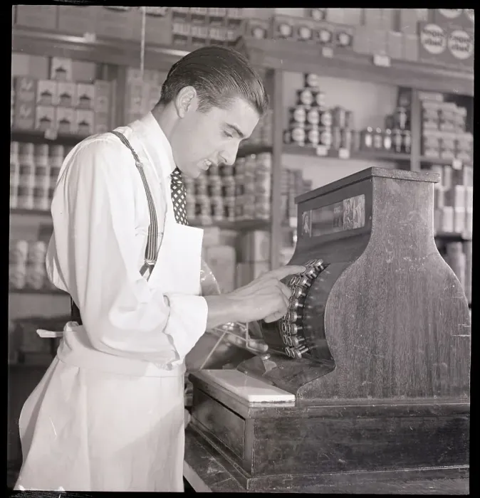Framed Print : Grocer At Cash Register Framed Print : Grocer At Cash Register