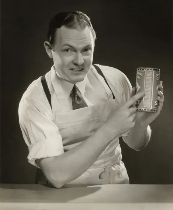 Framed Print : Grocer explaining label on product Framed Print : Grocer explaining label on product