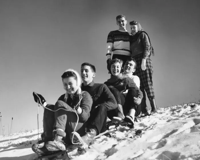 Framed Print : Group of friends tobogganing