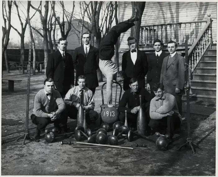 Framed Print : Group Of Men Posing Around Barbells Framed Print : Group Of Men Posing Around Barbells