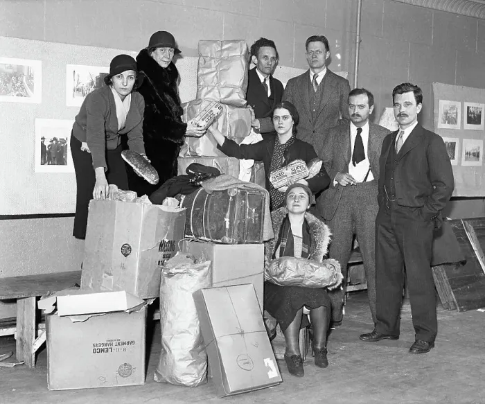 Framed Print : Group Posing with Boxes and Holding Bread