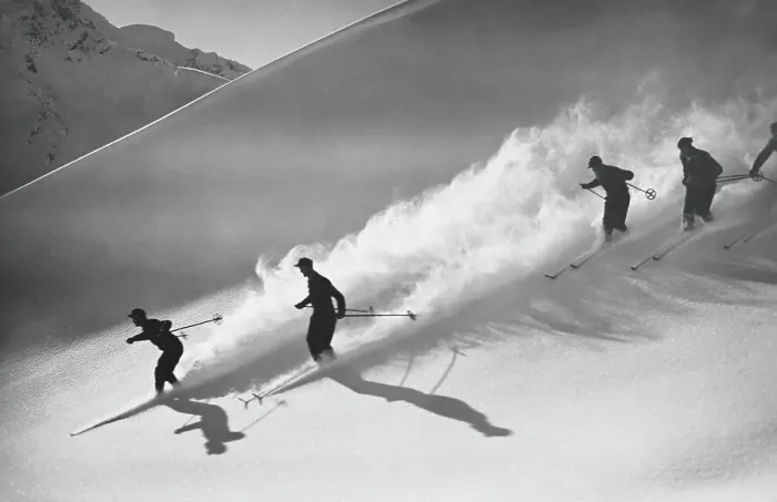 Framed Print : Group of skiers descending alpine slope, people in silhouette with sun low on horizon, casting long shadows on snow Framed Print : Group of skiers descending alpine slope, people in silhouette with sun low on horizon, casting long shadows on snow