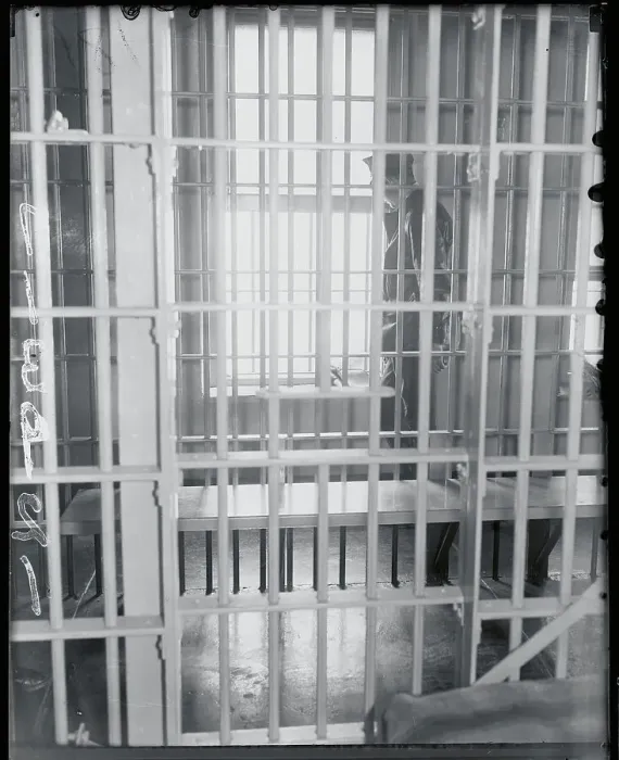 Framed Print : Guard as Seen Outside Jail Bars