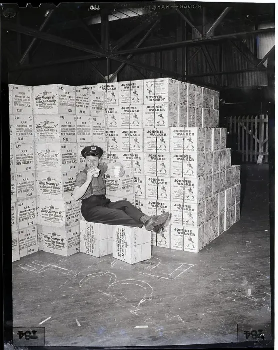 Framed Print : Guard Sits On Cases Of Whiskey Framed Print : Guard Sits On Cases Of Whiskey