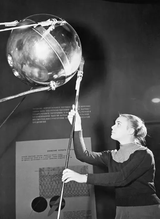 Framed Print : Guide Displays Model of Sputnik I