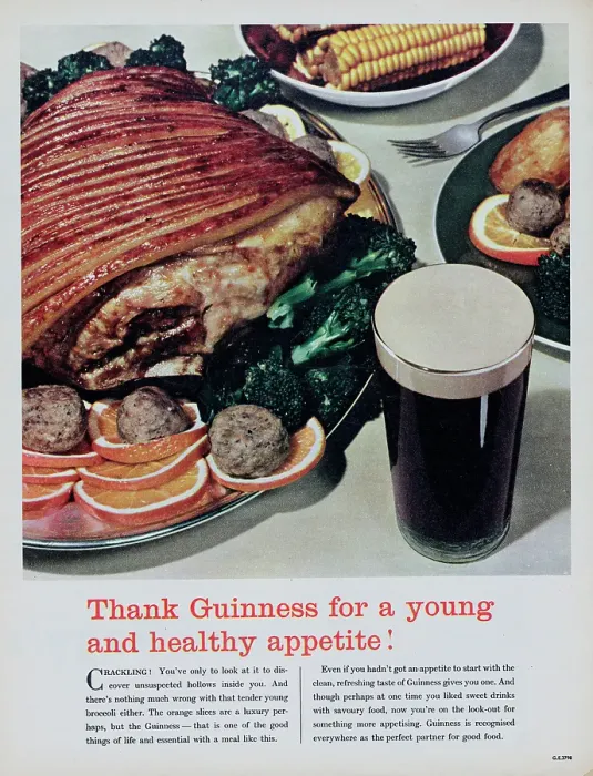Framed Print : Guinness. 1956: A glass of stout ale is shown next to a dinner of roast pork Framed Print : Guinness. 1956: A glass of stout ale is shown next to a dinner of roast pork