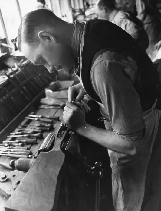 Framed Print : Gunmaking. 12th August 1939: A stocker fits the wood onto the action of Framed Print : Gunmaking. 12th August 1939: A stocker fits the wood onto the action of
