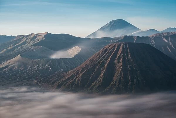 Gunung Bromo mountain active volcano with mt batok and mt semeru famous place in the morning fog. east java, indonesia