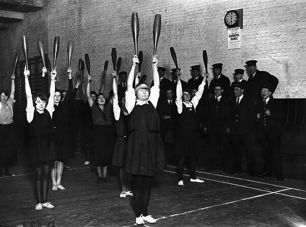Gym Club. 13th March 1925: Young women railway clerks swinging Indian clubs