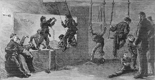 Gymnasium. 22nd October 1887: Young boys swinging and hanging