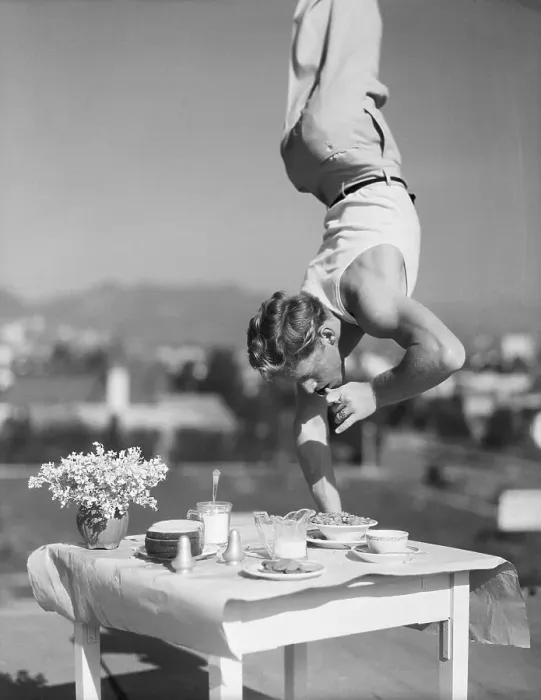Framed Print : Gymnast Richard Landau Performs Handstand on Table Framed Print : Gymnast Richard Landau Performs Handstand on Table