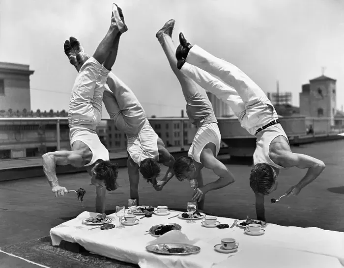 Framed Print : Gymnasts Eating While Doing Handstands Framed Print : Gymnasts Eating While Doing Handstands