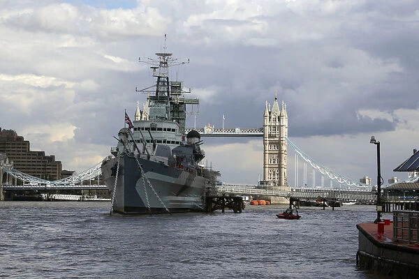 H. M. S. Belfast and the London Bridge in the background seen from the River Thames