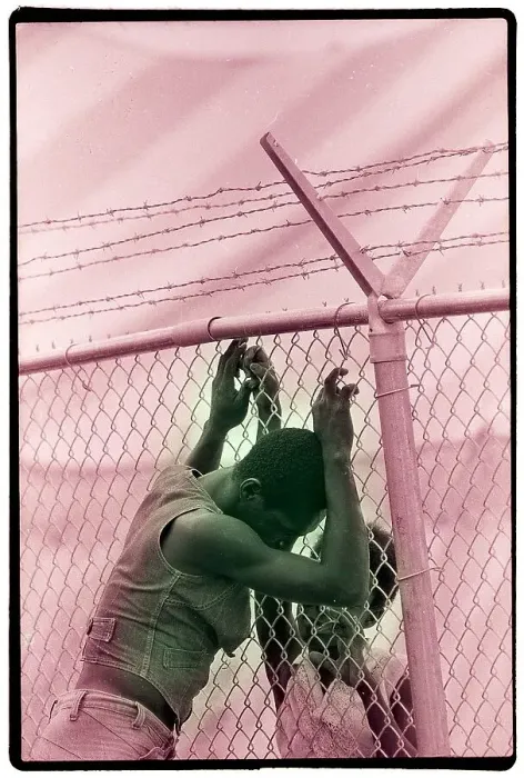 Framed Print : Haitian Couple Speak Through Fence Framed Print : Haitian Couple Speak Through Fence