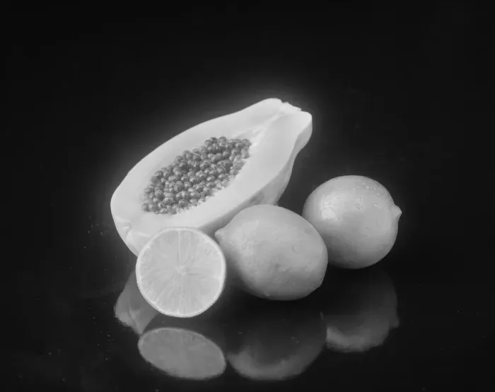 Framed Print : Half cut papaya and lemon on black background Framed Print : Half cut papaya and lemon on black background