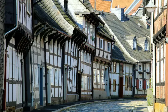 Framed Print : Half timbered houses and cobbled street in the historic old town of Goslar, Germany Framed Print : Half timbered houses and cobbled street in the historic old town of Goslar, Germany