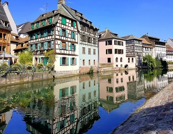 Half-timbered houses reflected in the Ill river, Strasbourg, France