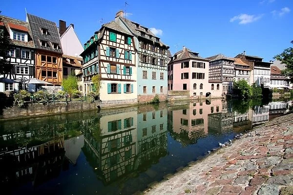 Half-timbered houses reflected in the Ill river, La Petite France quarter, Strasbourg, France
