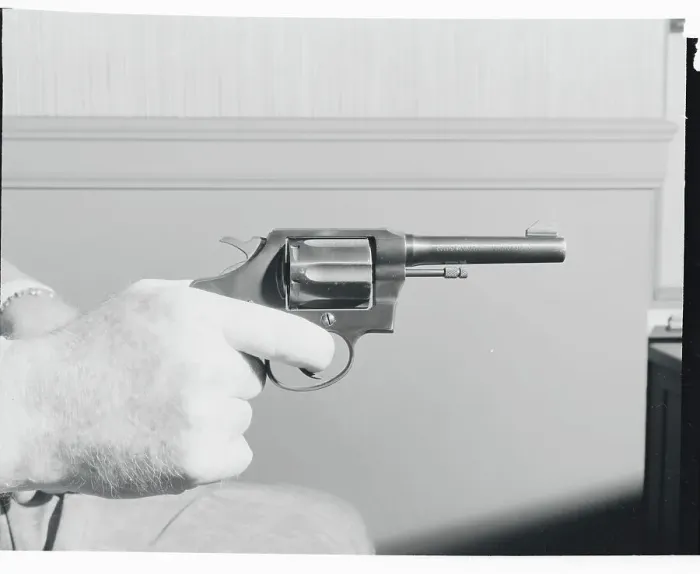 Framed Print : Hand Holding Colt.38 Special Revolver