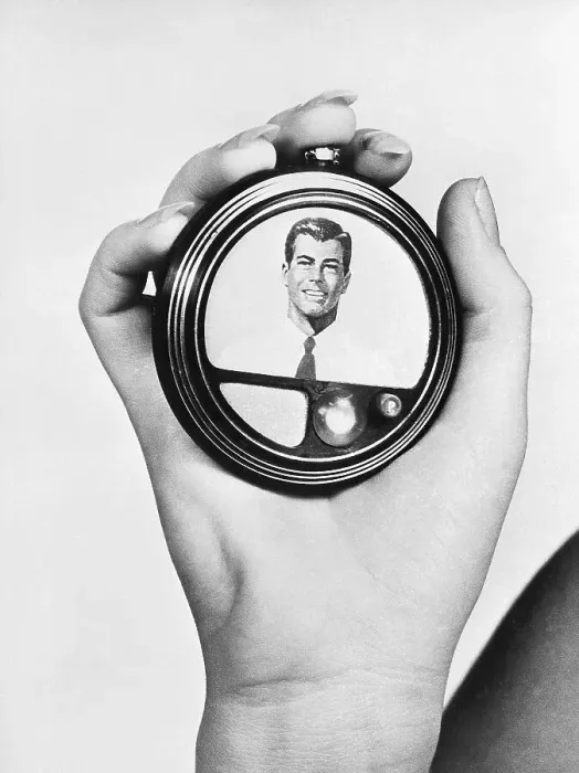 Framed Print : Hand Holding a Model for a Video Telephone Framed Print : Hand Holding a Model for a Video Telephone