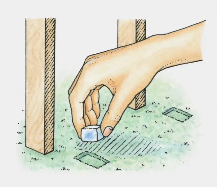 Framed Print : Hand placing ice cube into dent in carpet caused by legs of table or chair (removing dent in carpet) Framed Print : Hand placing ice cube into dent in carpet caused by legs of table or chair (removing dent in carpet)