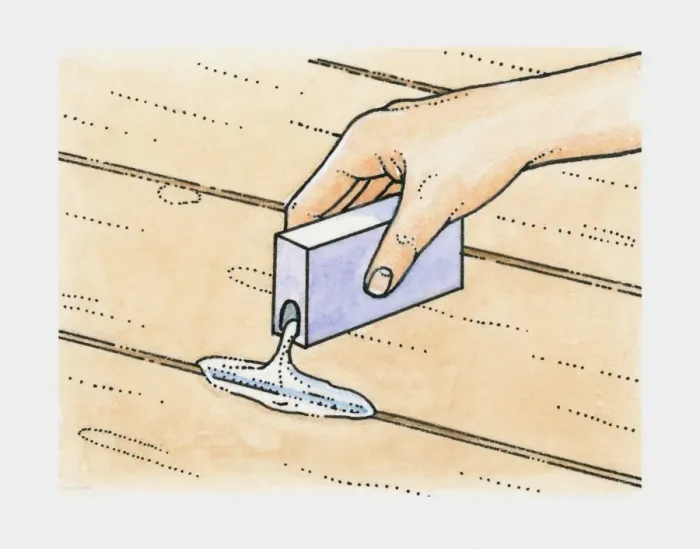 Framed Print : Hand pouring talcum powder into cracks between old floorboards to prevent squeaks Framed Print : Hand pouring talcum powder into cracks between old floorboards to prevent squeaks