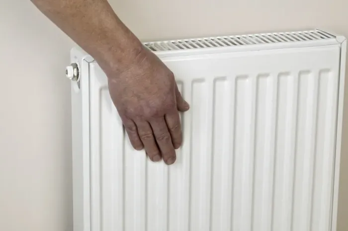 Framed Print : Hand on radiator Framed Print : Hand on radiator