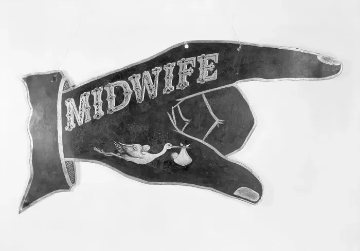 Framed Print : Hand Shaped Sign Advertising for a Midwife Framed Print : Hand Shaped Sign Advertising for a Midwife
